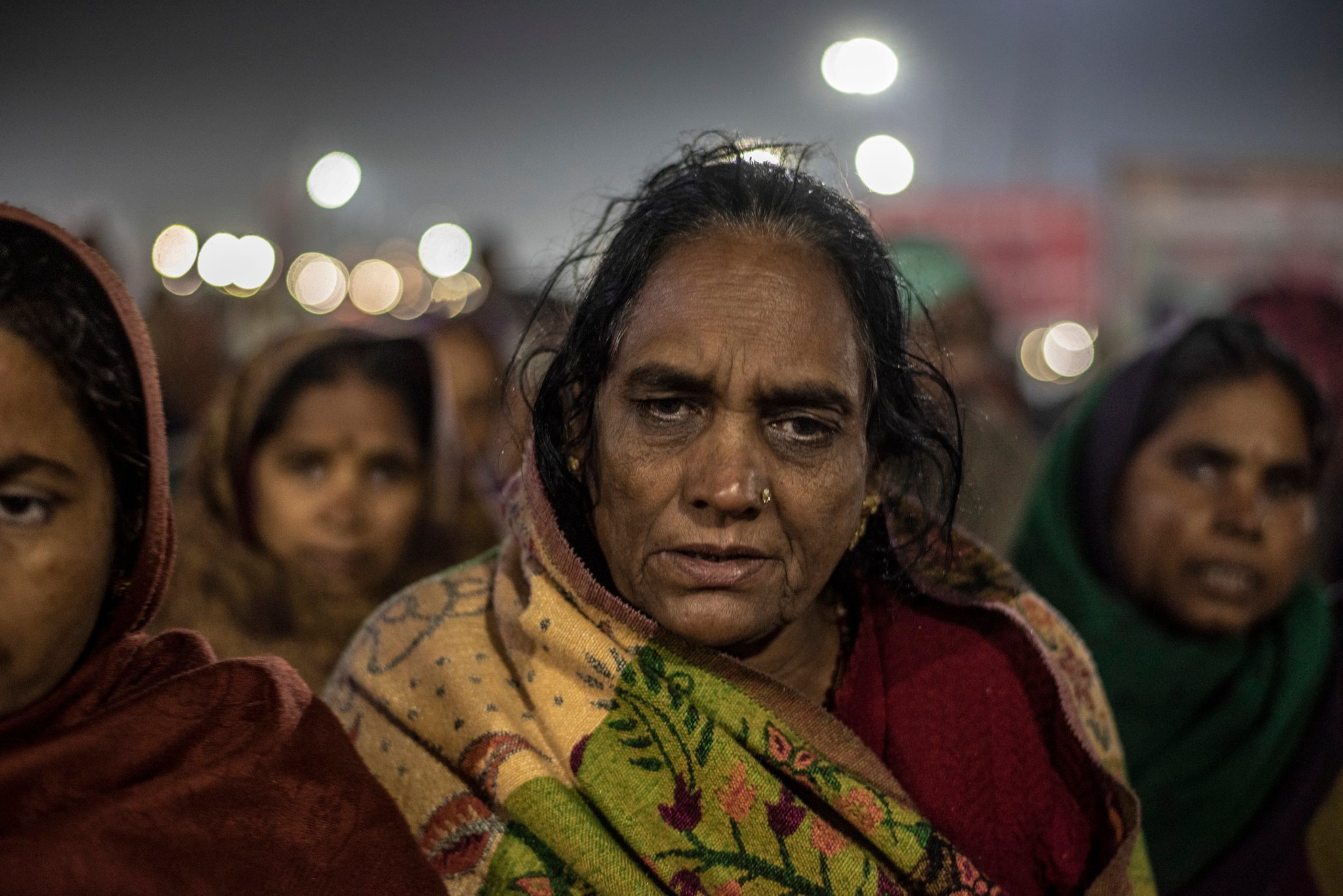 A group of women begin their early morning trek to Sangam
