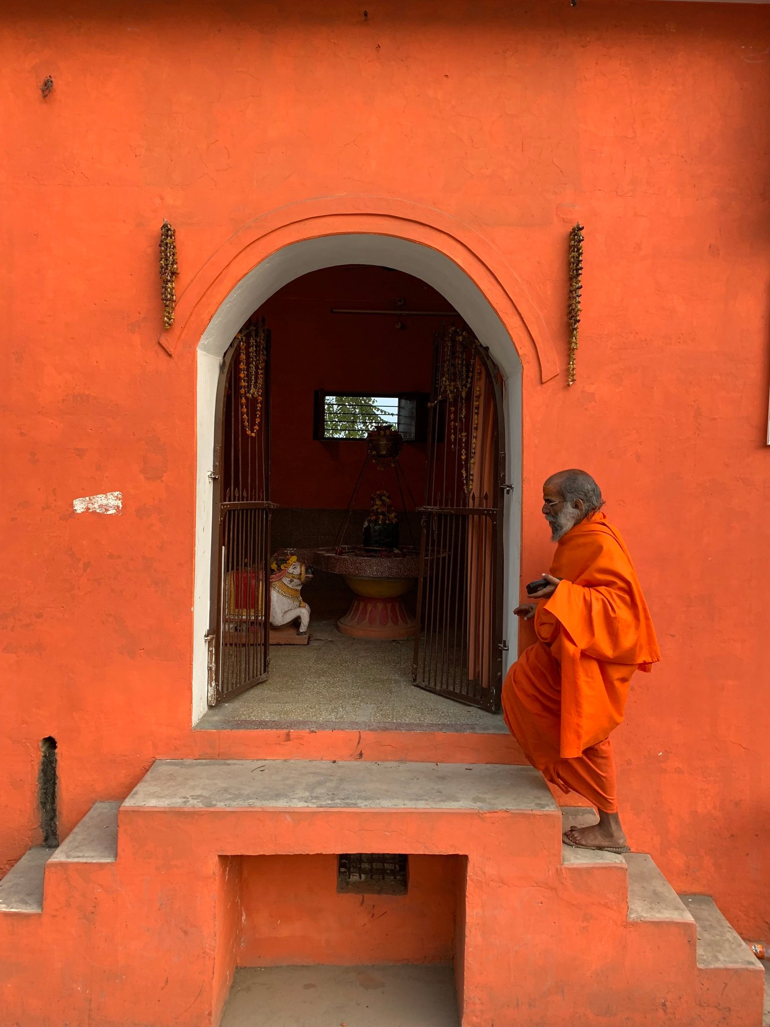Guru enters a Hindu temple that he upkeeps.