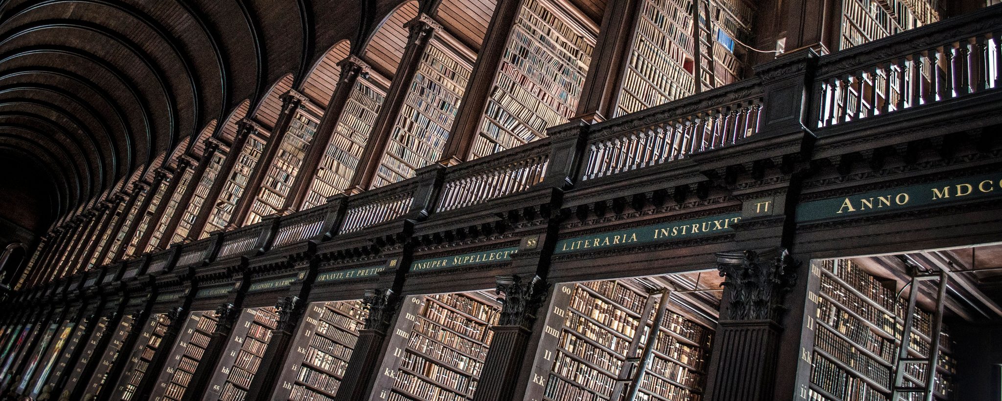 The Long Room's shelves climb to its barrel-vaulted ceiling.