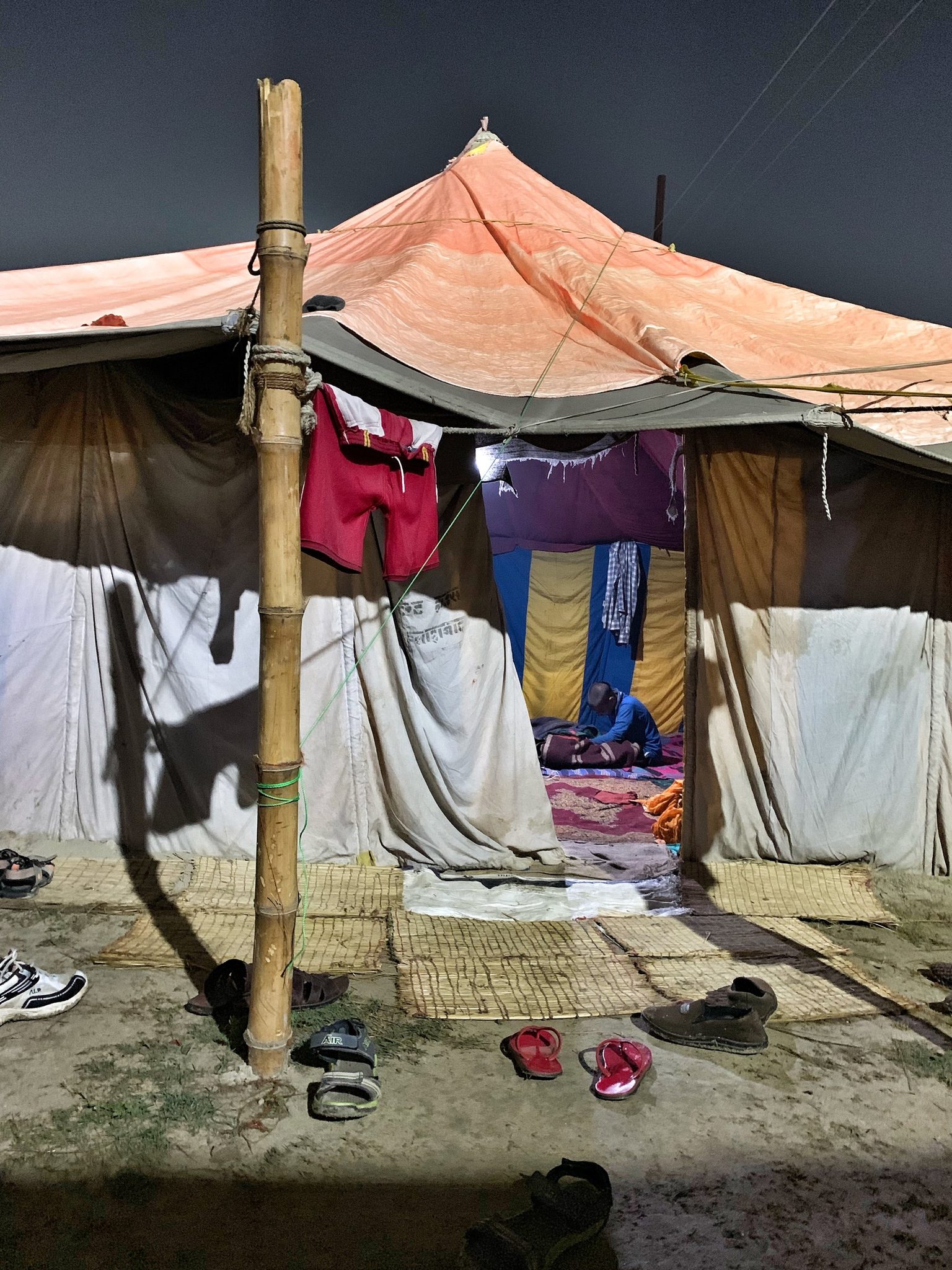 Novice monk studies in his tent