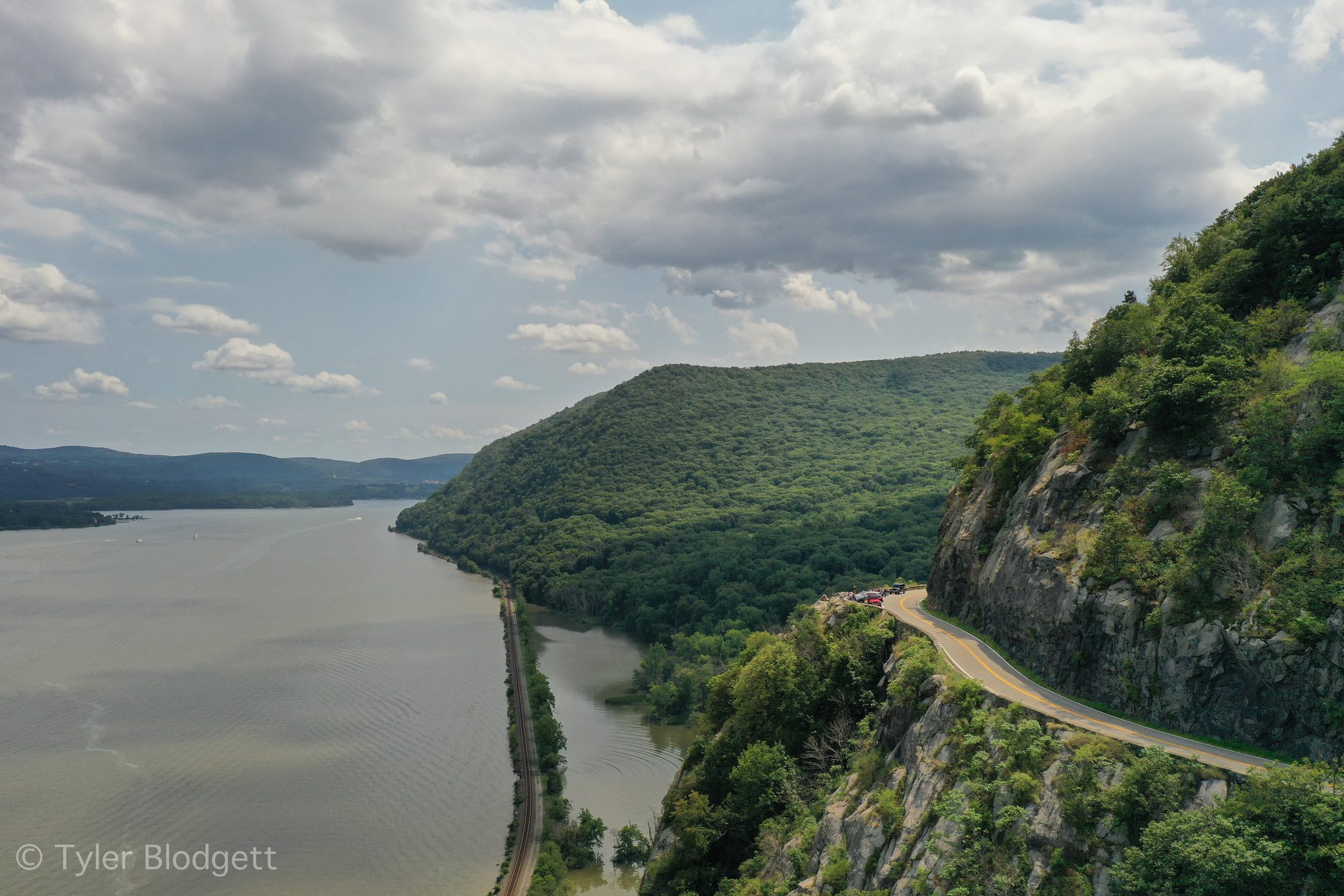 From above, the road clings to the cliffs as the Hudson winds between the mountains.
