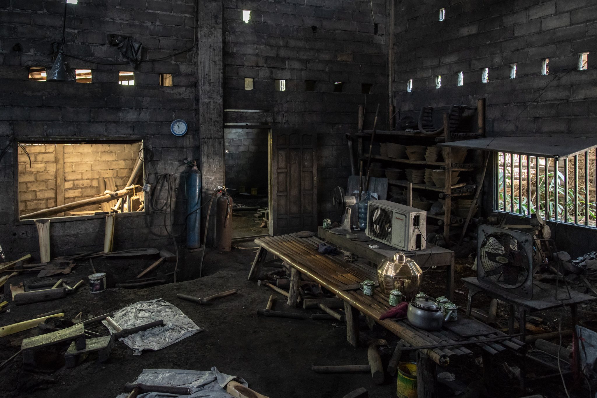 The workshop at rest, tools and a kettle waiting on the bench for the next pour.