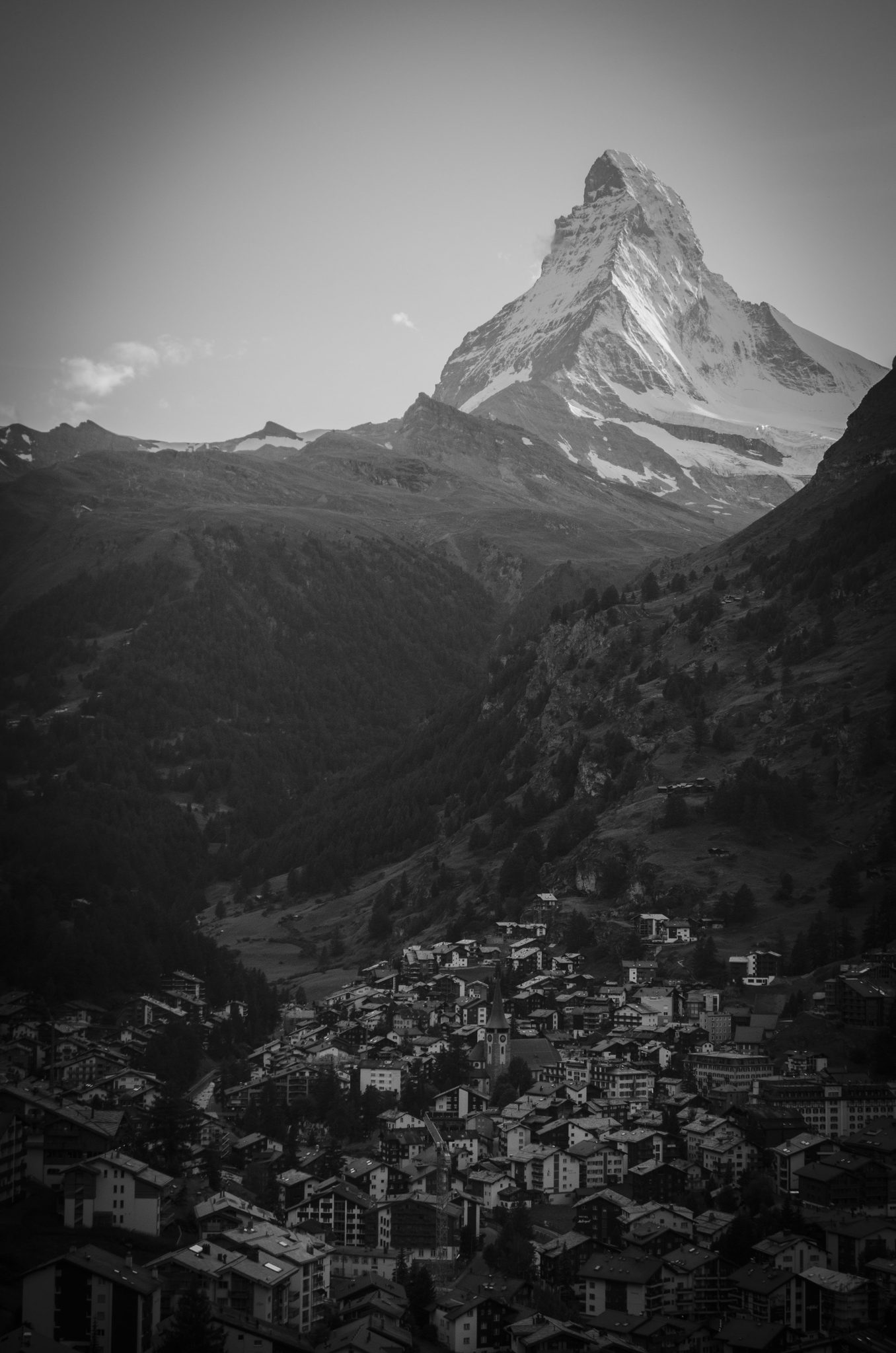 The Matterhorn rises above Zermatt, in black and white.