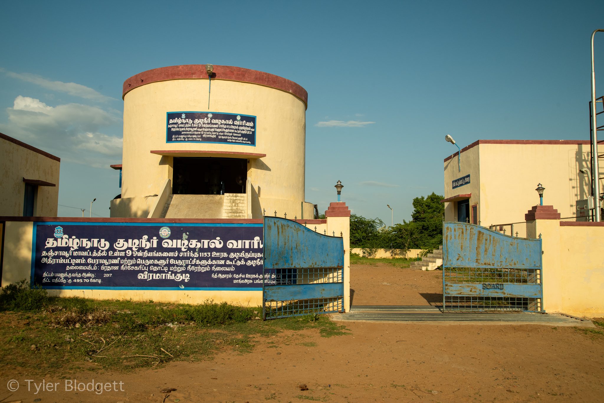 A Tamil Nadu water board pumping station stands at the edge of the river.