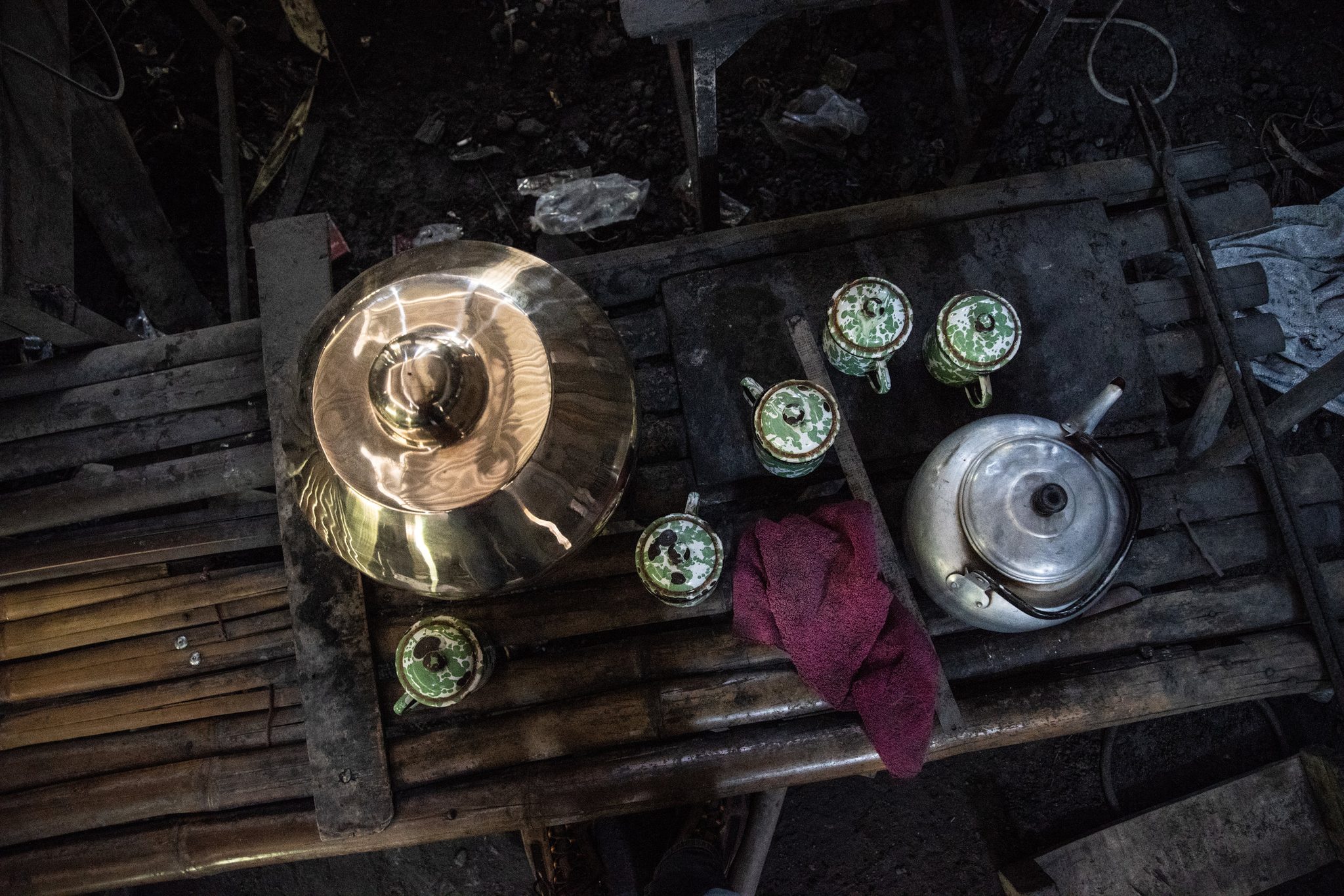 Recently crafted gamelan gong perched on a bench