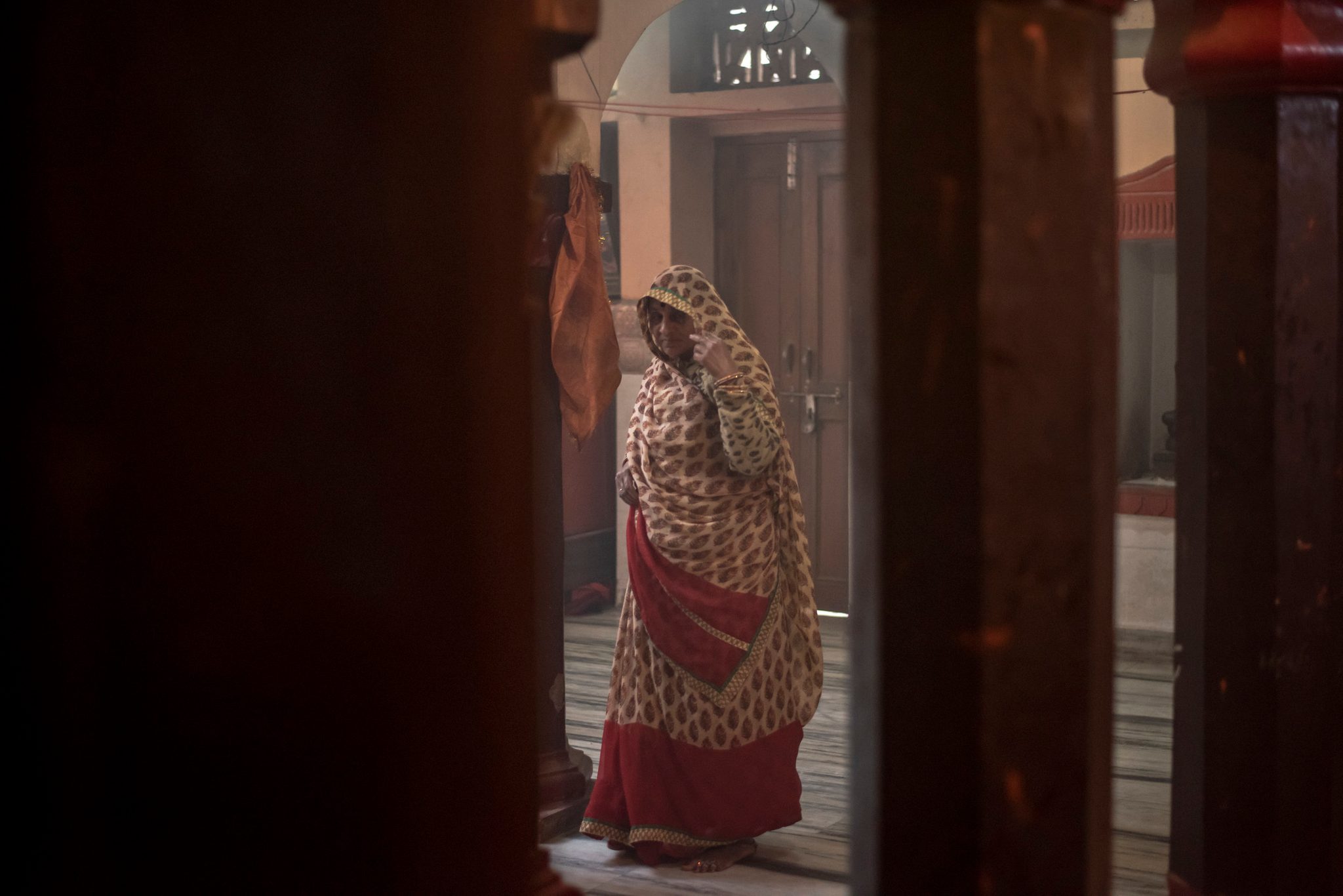 Women visits local shrine to pray to the Gods