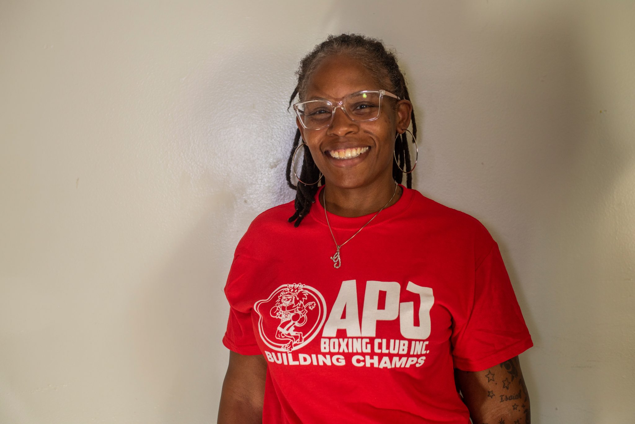 Close in, laughing, the club logo bright on her shirt.