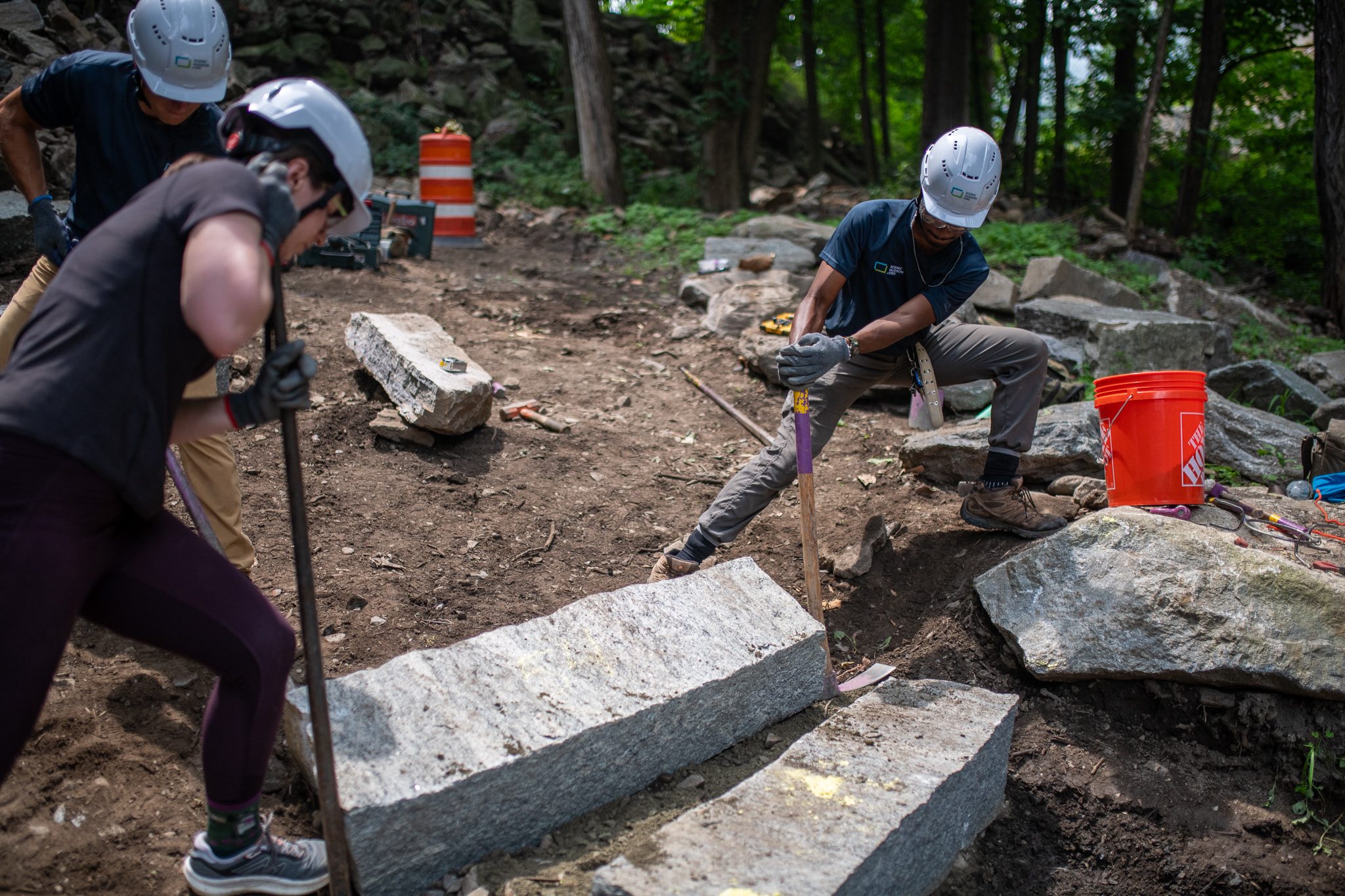 The crew works across a finished run of steps.