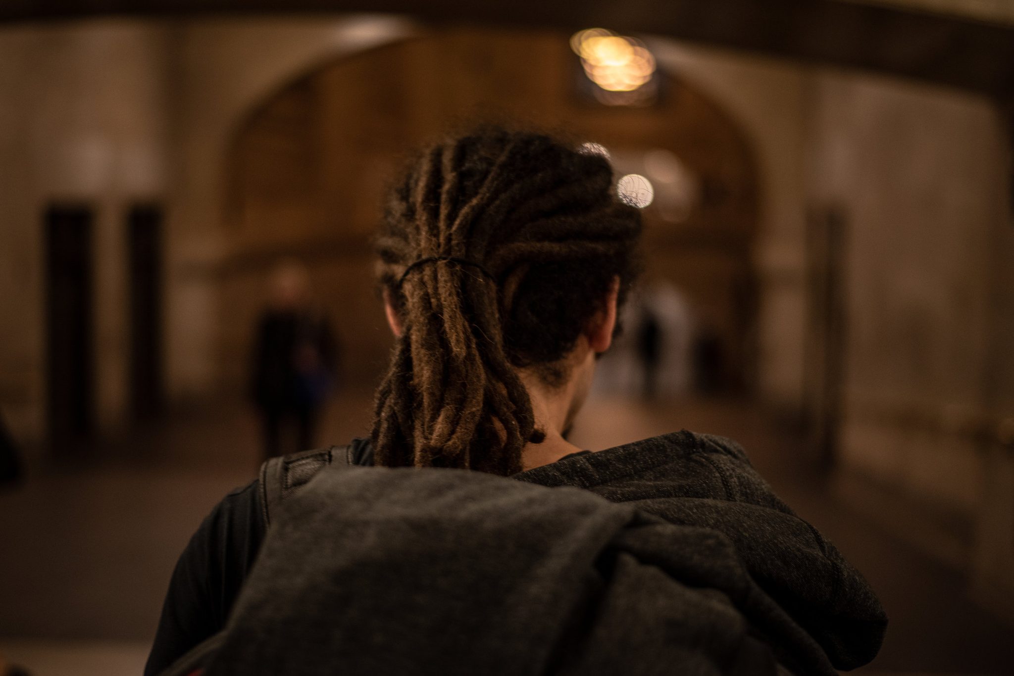 Dreadlocks tied back, Anthony walks into the terminal ahead of the rush.