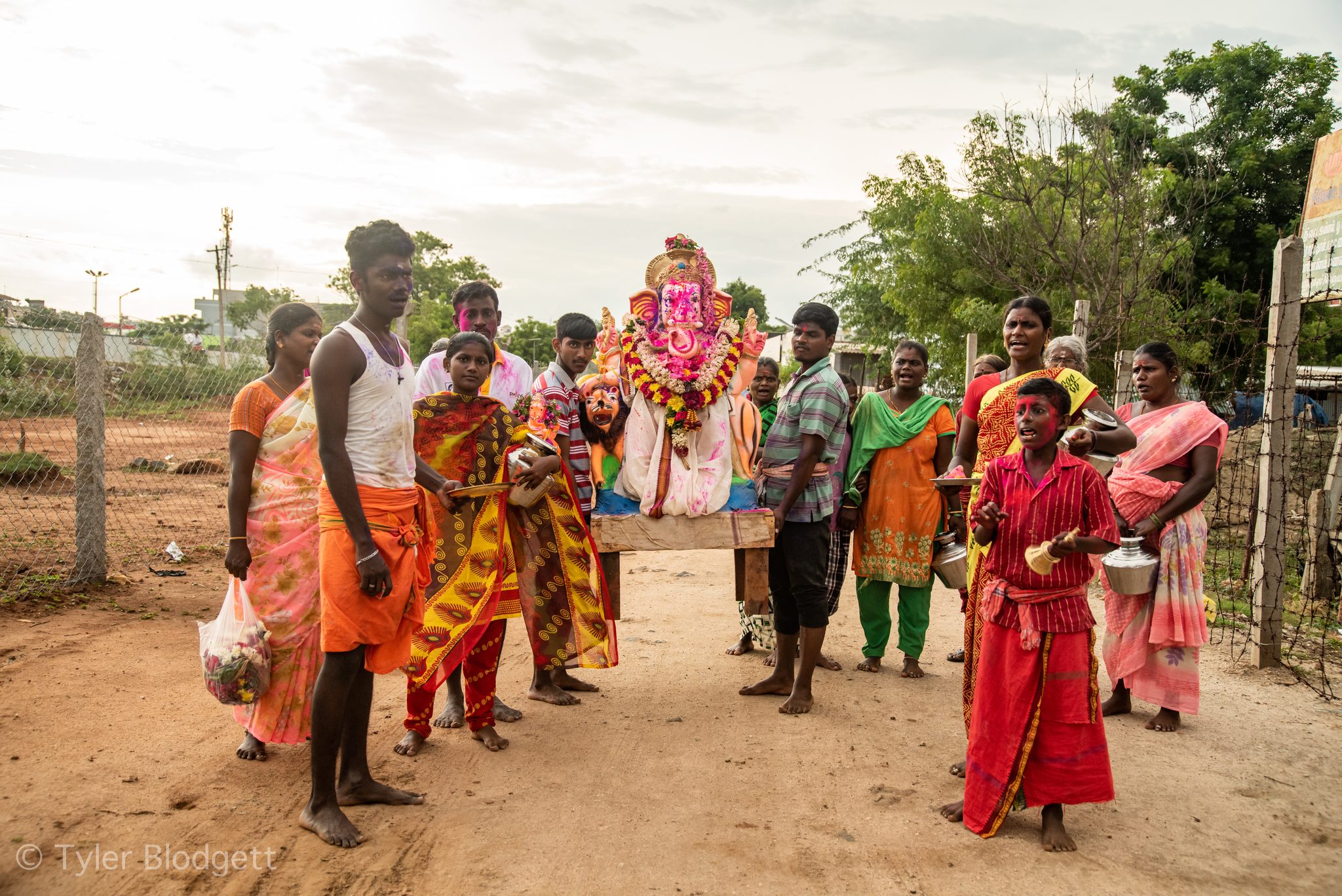Families gather around the Ganesha idol for its journey.