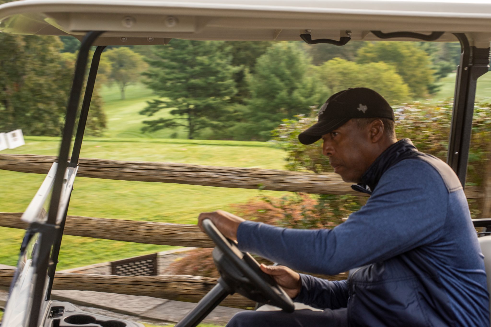 A golfer settles into the cart for the first hole.