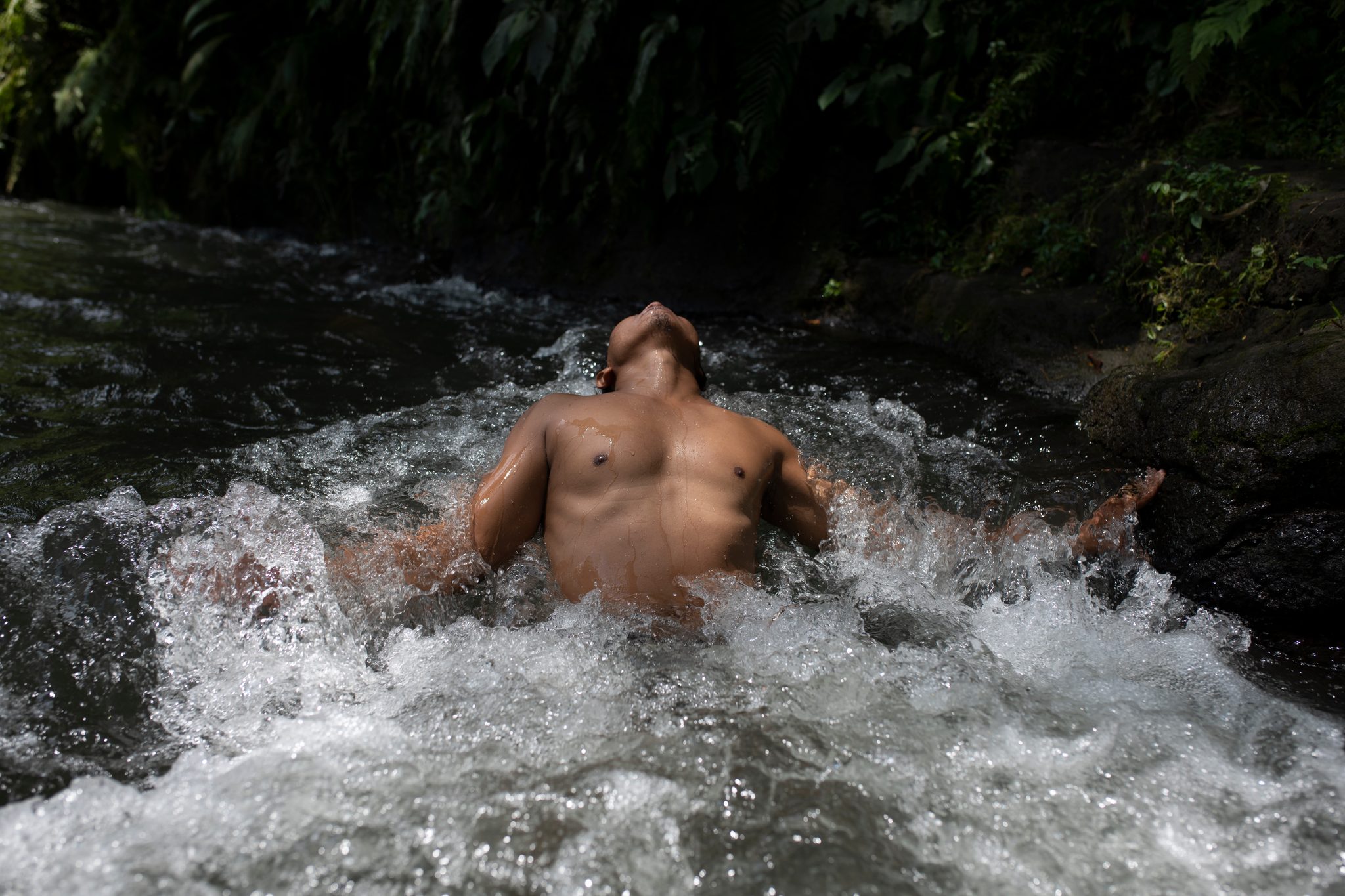 Face turned to the sky, he lets the current hold him.