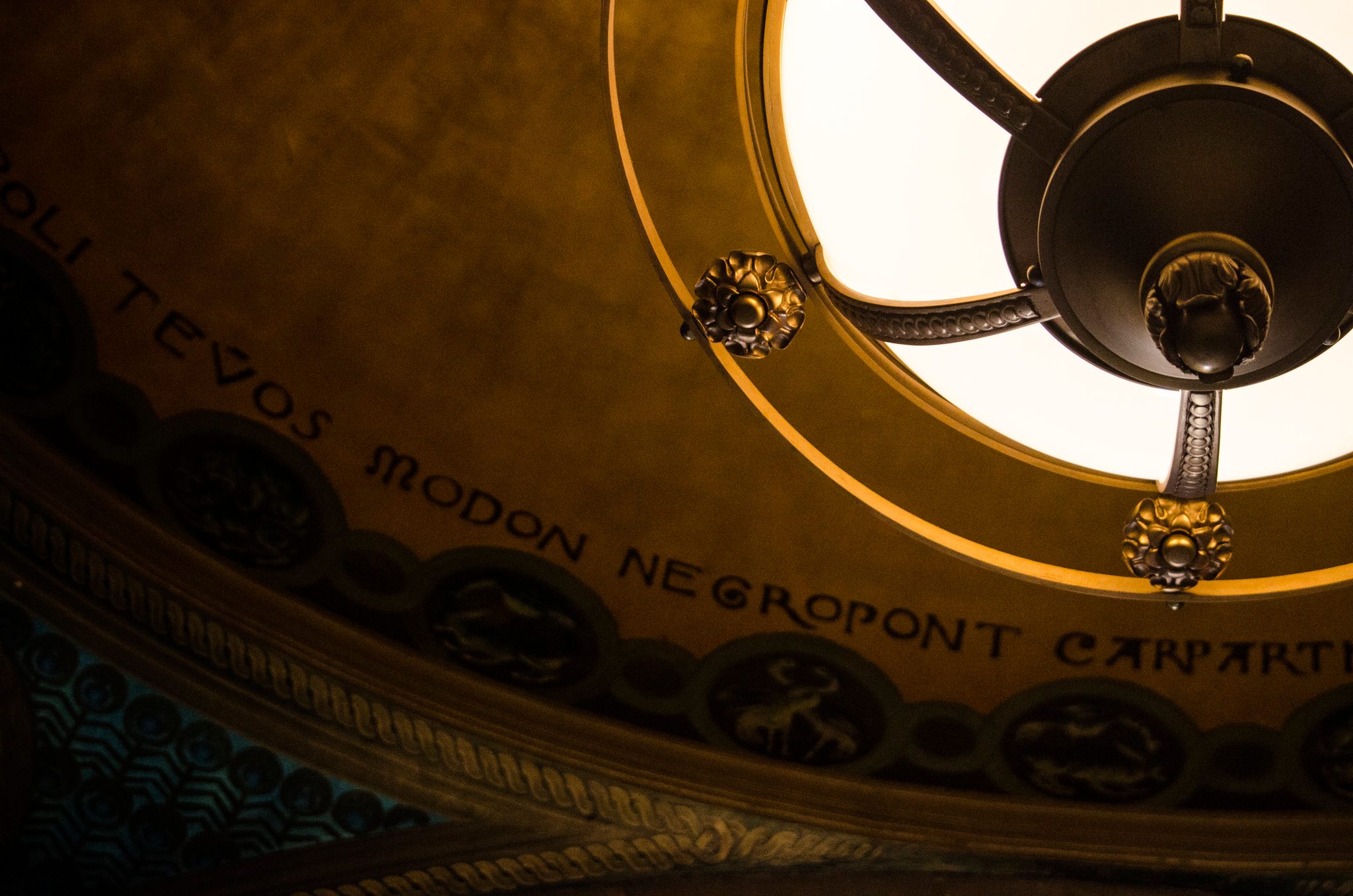 Painted place names ring the dome around a gilded skylight.