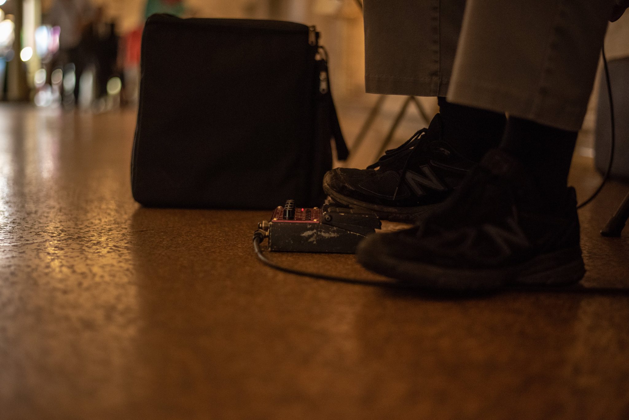 A foot on the pedal, the amp waiting in the corner.