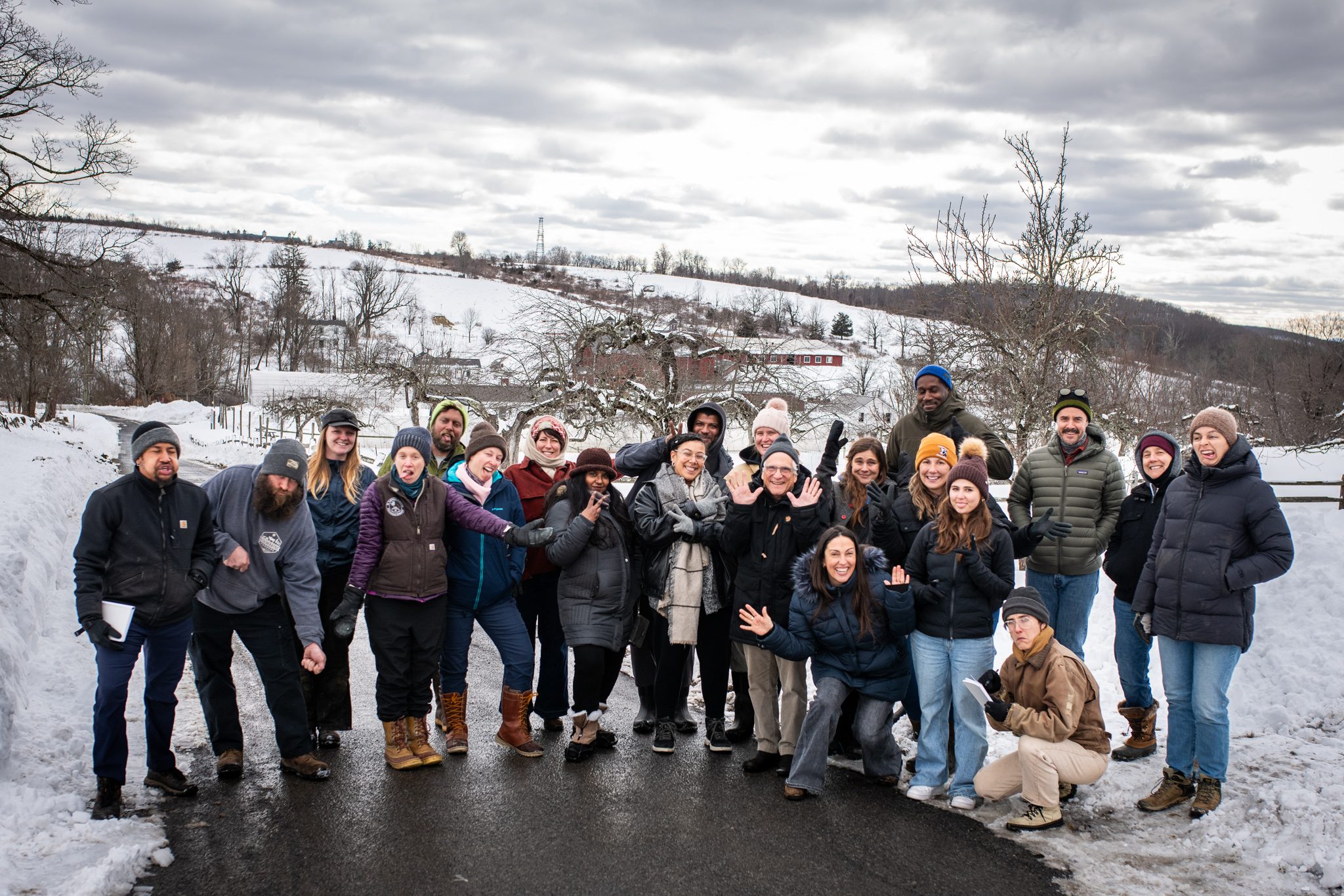 Everyone gathers on the snowy drive for a group portrait.
