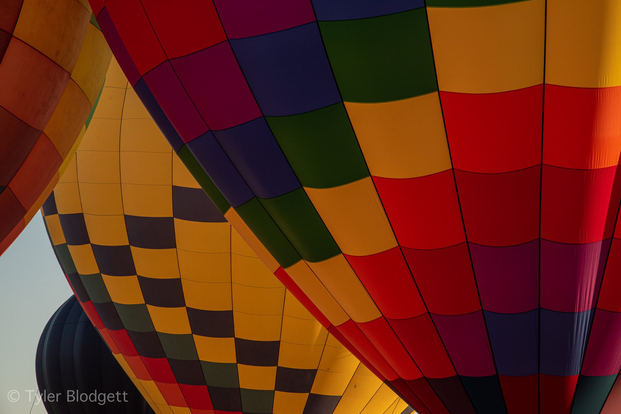 Seen up close, the balloons become a quilt of red, gold and green.