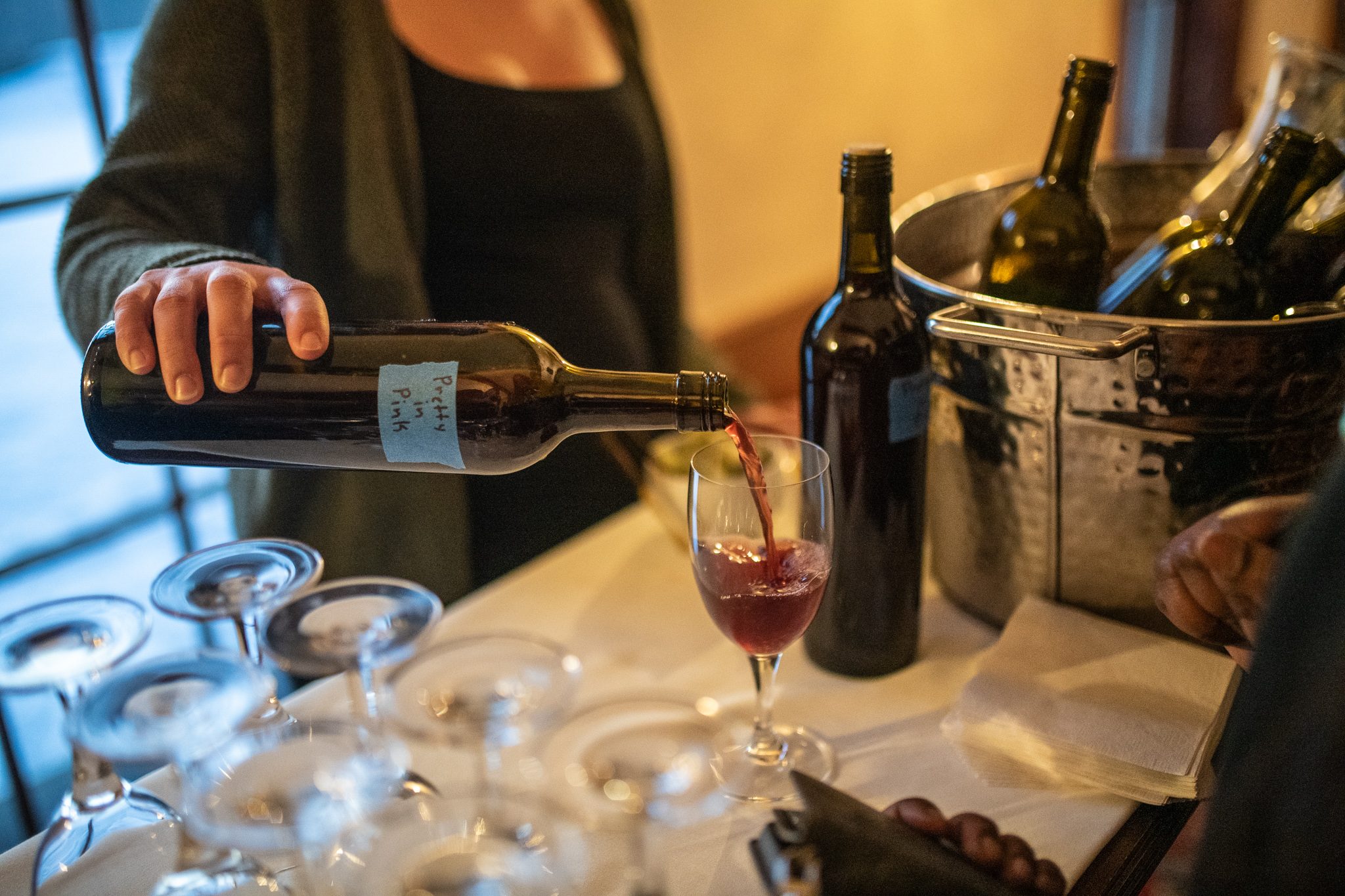 Red wine poured as the evening gathering begins.