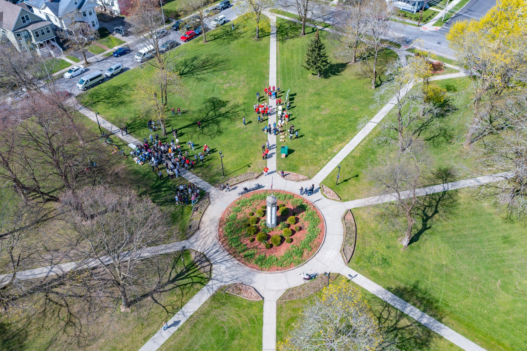 From above, volunteers gather where the park's paths meet, ready to fan out.