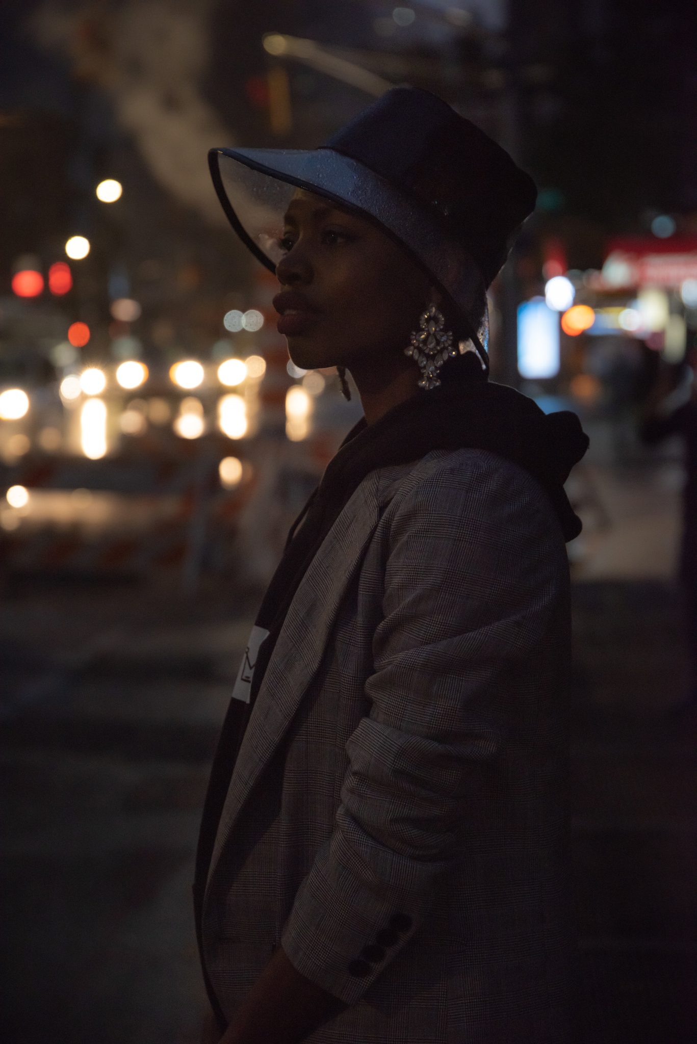 She was a midnight vixen, born from shadows, a shapeshifter, drifting through neon lights.