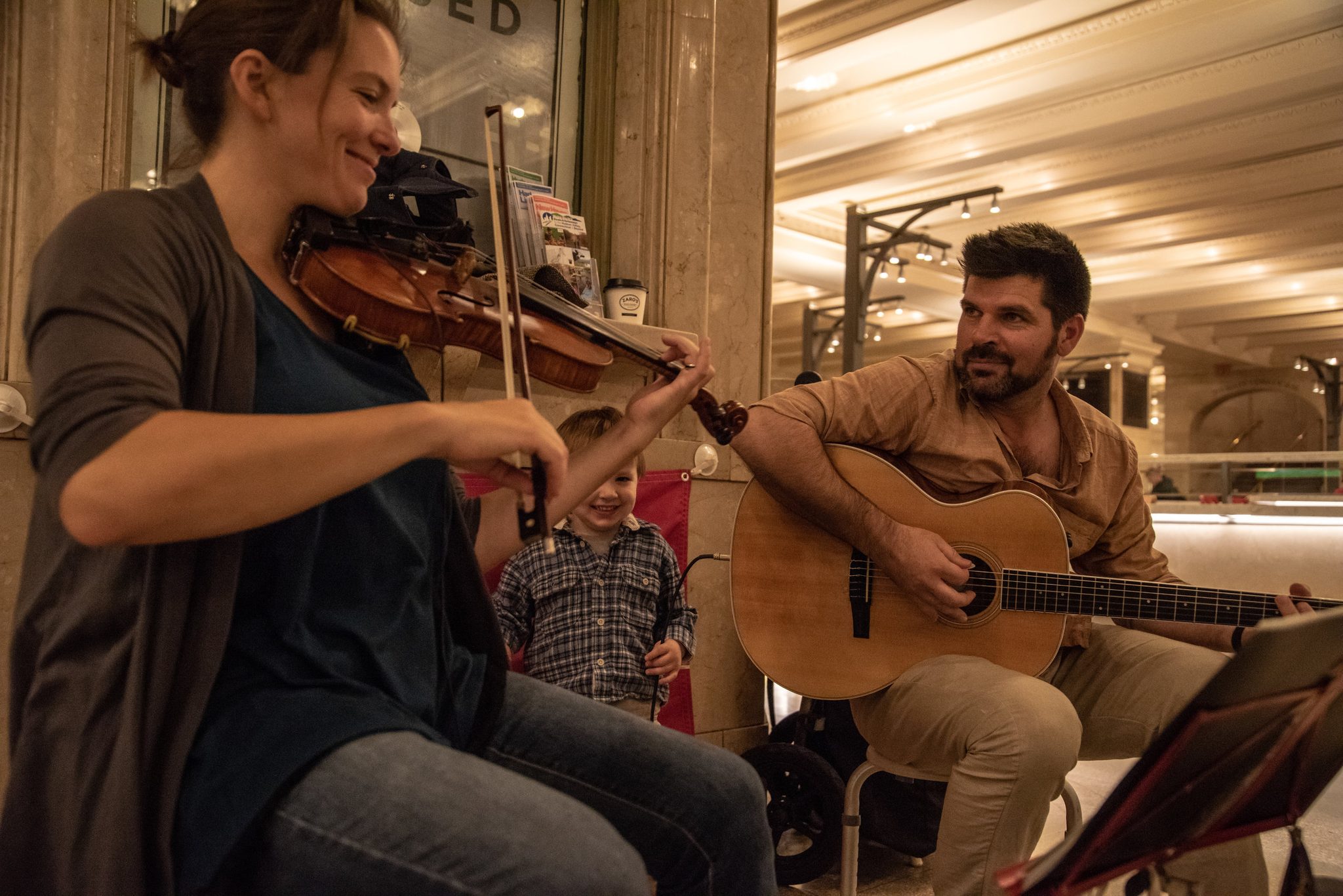 Their three year old son, Ronin, often joins them while they busk (perform for money)