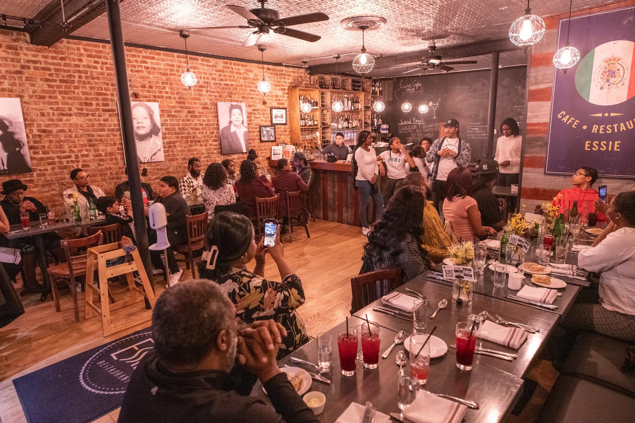 The dining room fills for the dinner the students cooked.