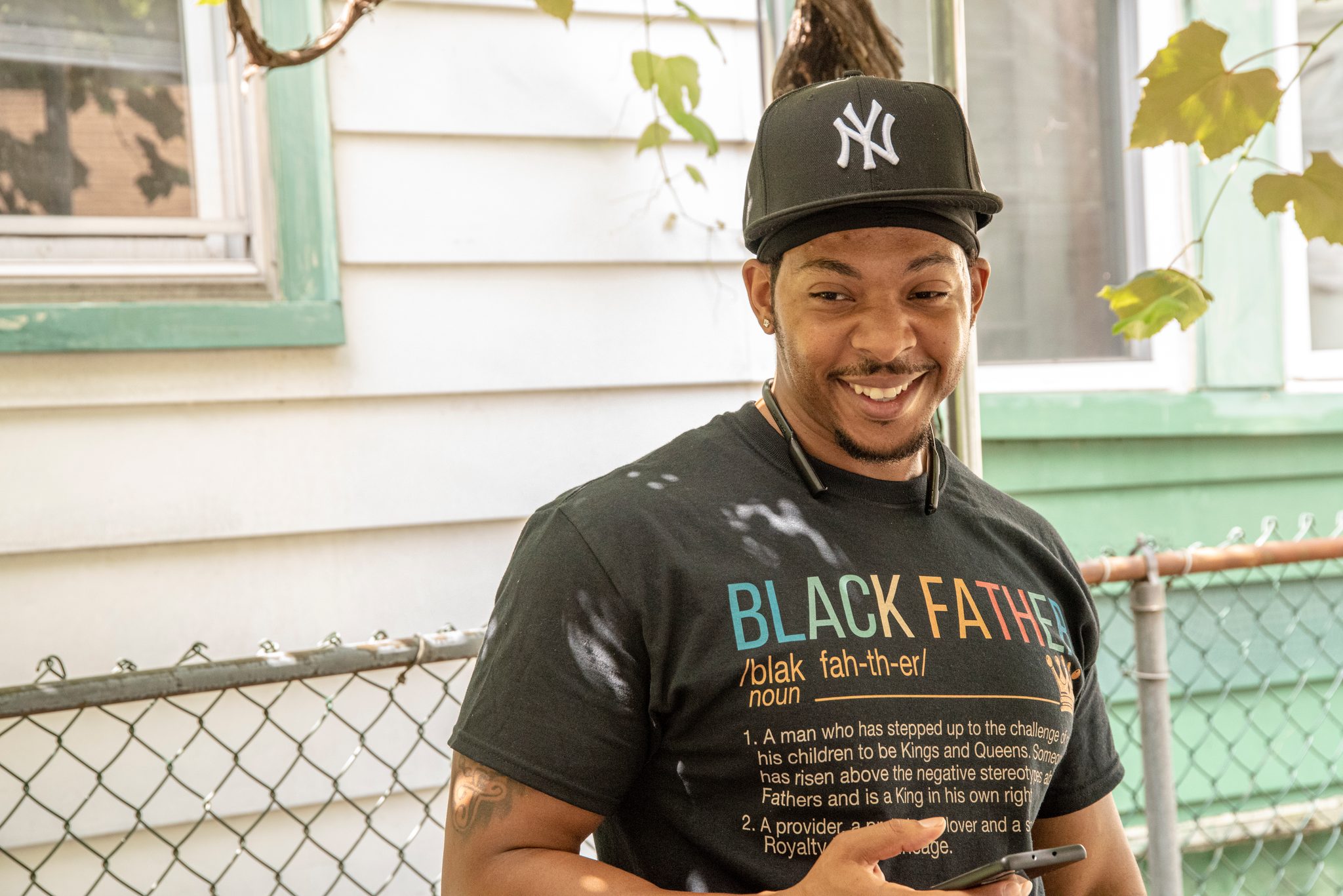 Black Father, spelled out like a dictionary entry across his shirt.