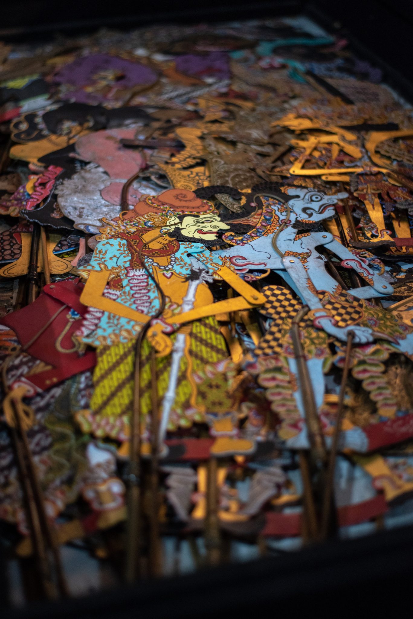 Shadow puppets stacked in the cempala (large wooden chest)