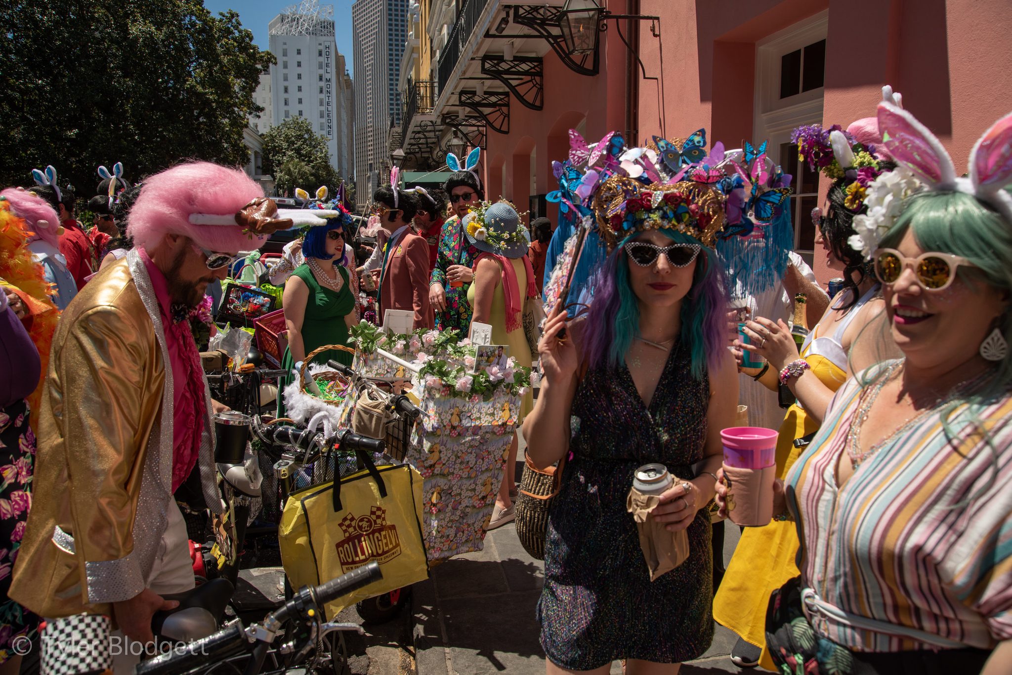 Flower crowns, bunny ears and bright wigs fill the street for the Easter parade.