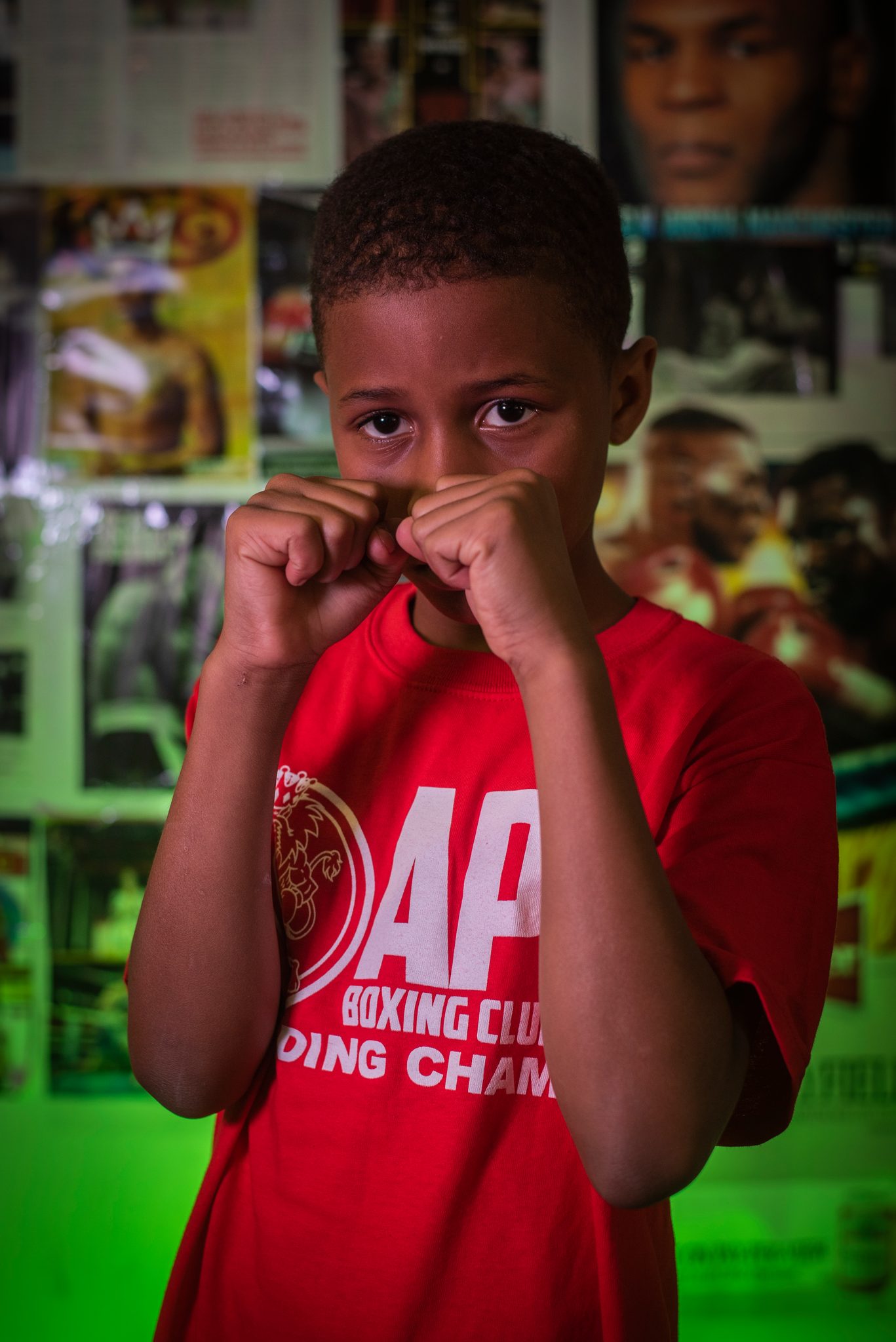 Peeking over his fists, the youngest stance on the wall.