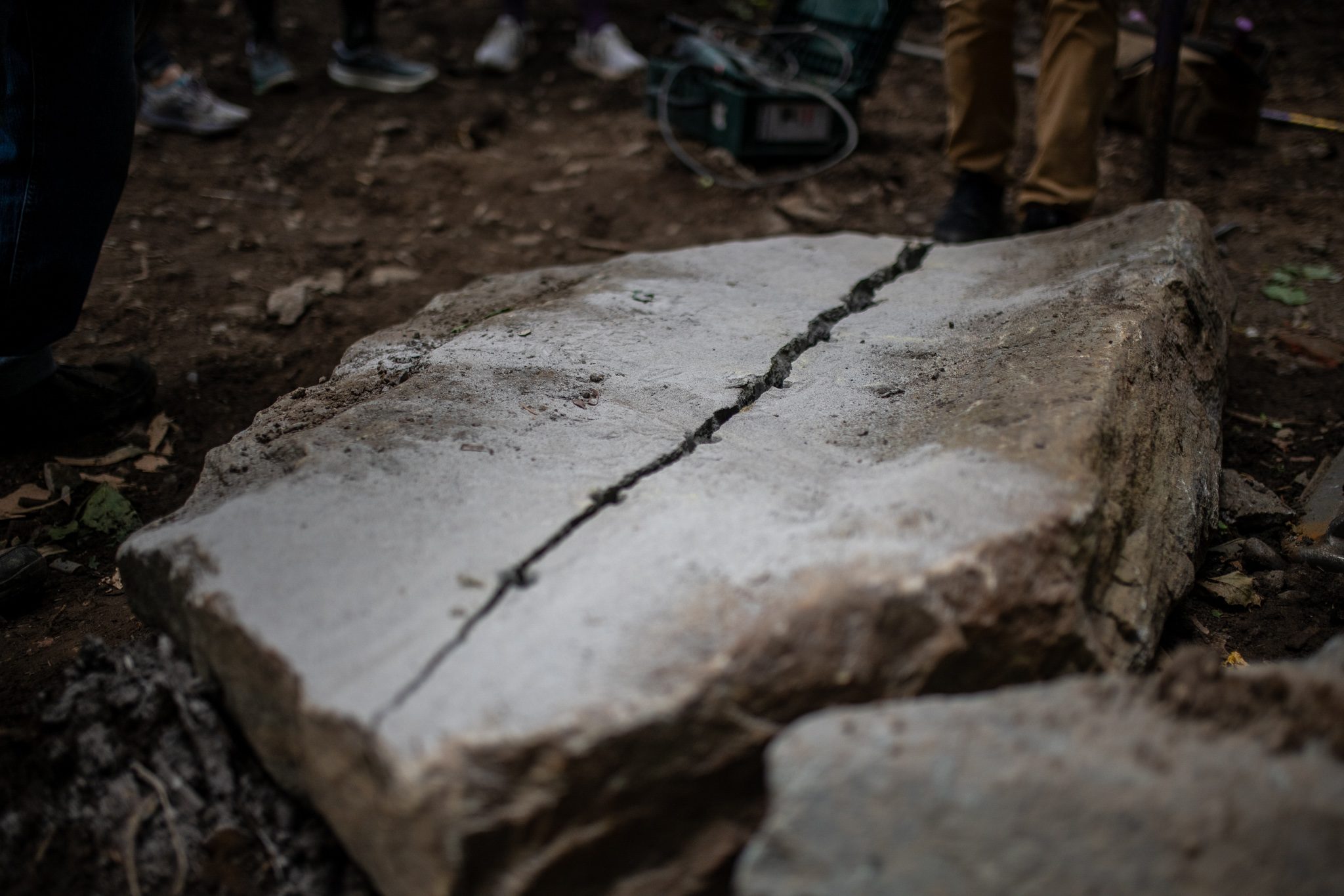 The slab splits clean along the drilled line.